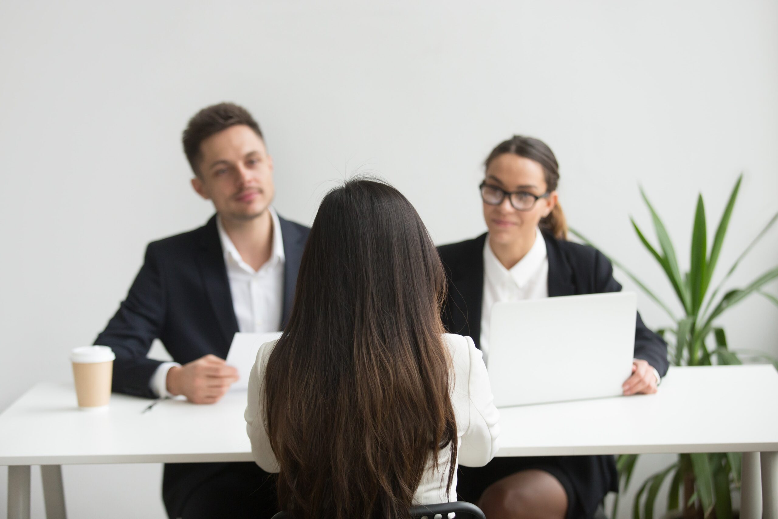headhunters-interviewing-female-job-candidate-min